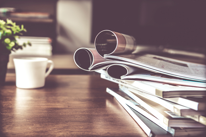 selective focus of stacking magazine place on table in living room