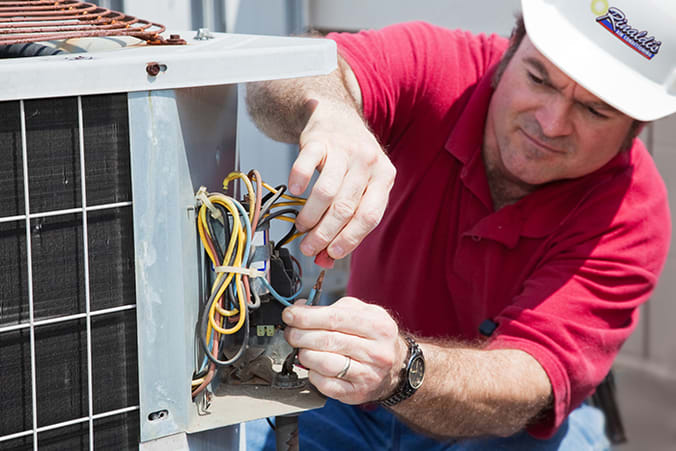 Man repairing HVAC system