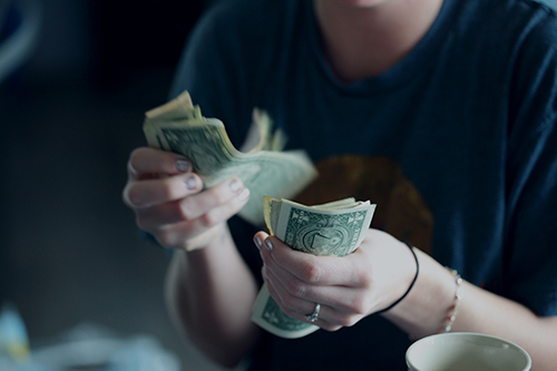 woman paying for HVAC