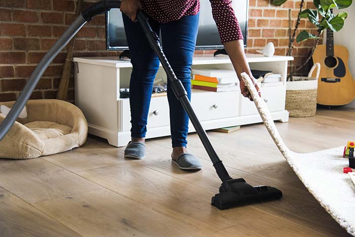 Black woman is cleaning room