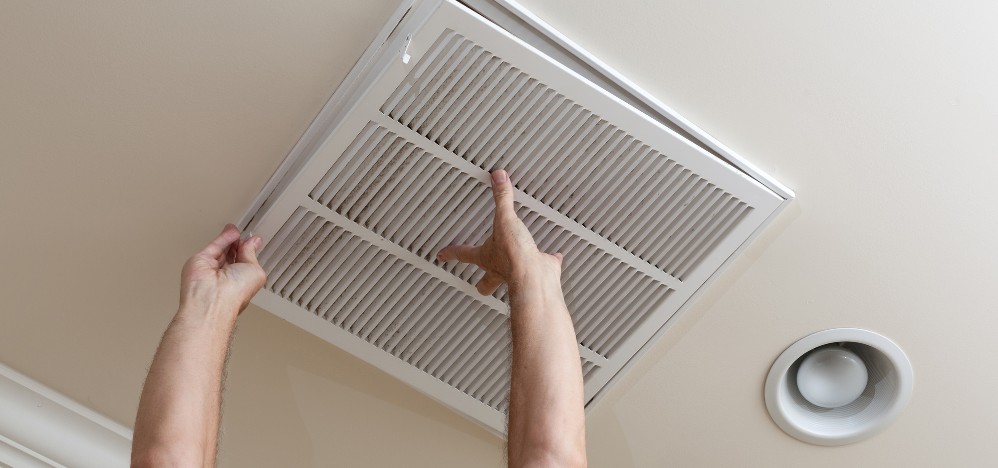 Man changing dirty air filter