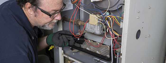 Technician checking air filter