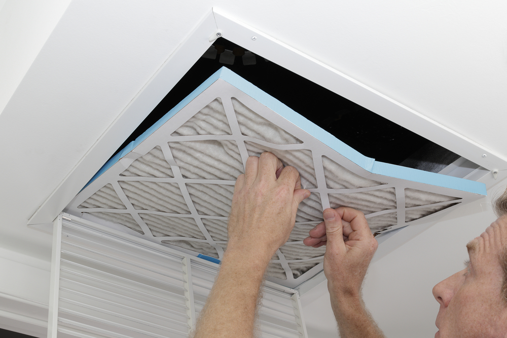 Man removing an air filter