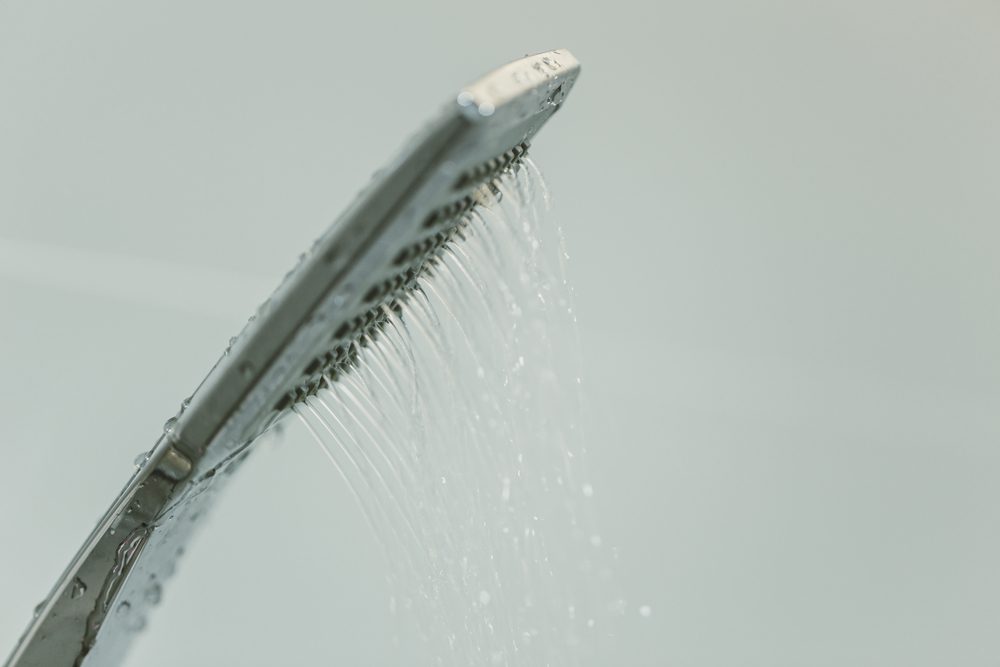 a shower head spraying with low water pressure